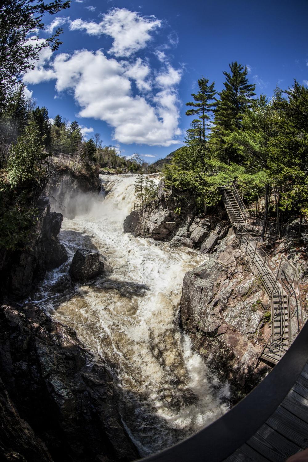 Walkway heading towards a waterfall along the Au Sable River at High Falls Gorge