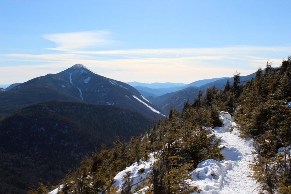 A panorama of mountains opens up just before the summit.