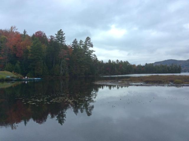 And in back, Lake Placid, the lake. There are canoes and Adirondack chairs and the McKenzie Mountain wilderness in the background.