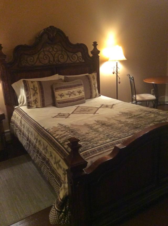 This elaborately carved bed is part of their distinctive atmosphere; old world elaboration with modern comforts.
