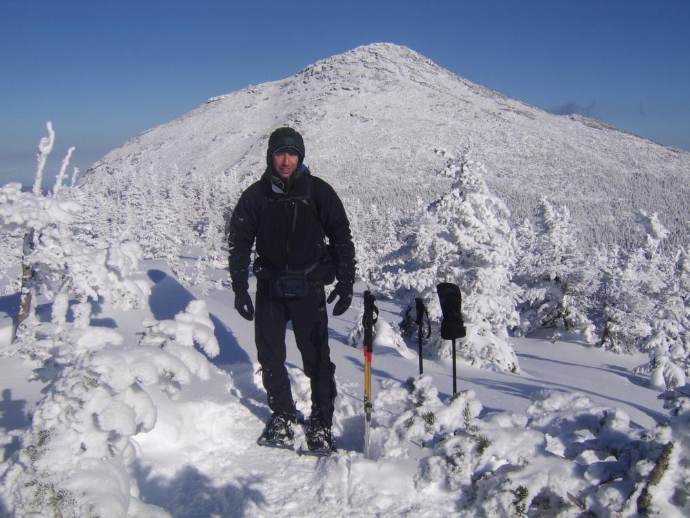 A hiker in the High Peaks in winter. Very snowy conditions.