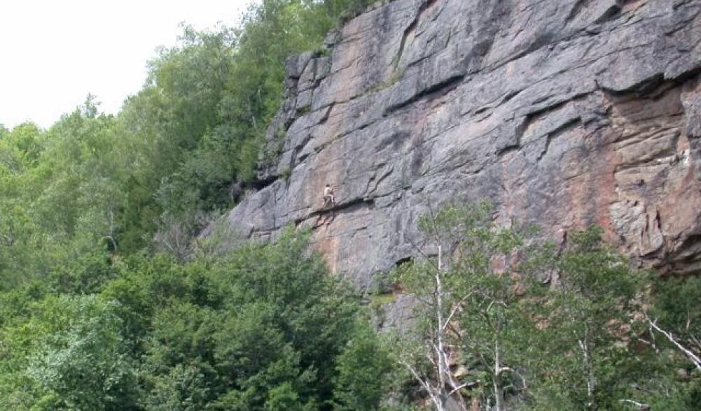 Rock Climber on cliffs of Pitchoff