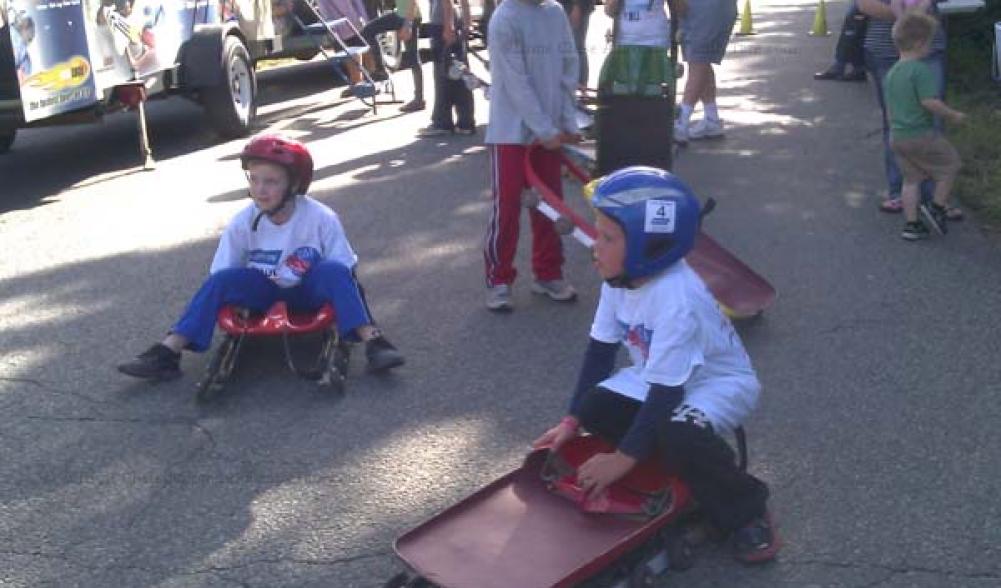 Kids enjoy wheeled luge sleds