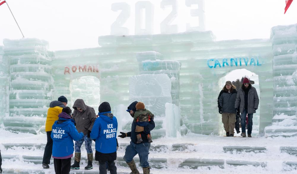 people walking around the ice castle