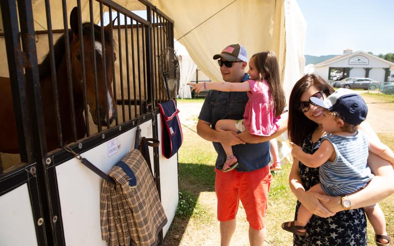 Family visits the horses at the Lake Placid Horse Show