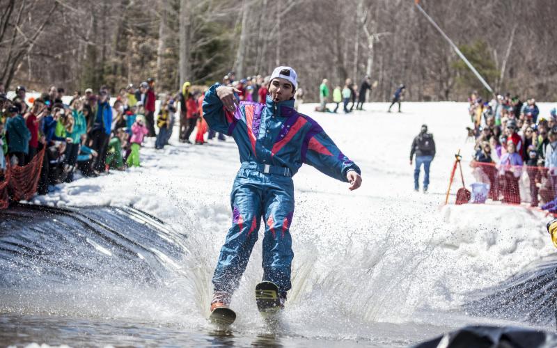 Person pond skimming in snowsuit