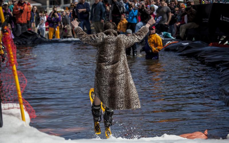 Person pond skimming in fur coat