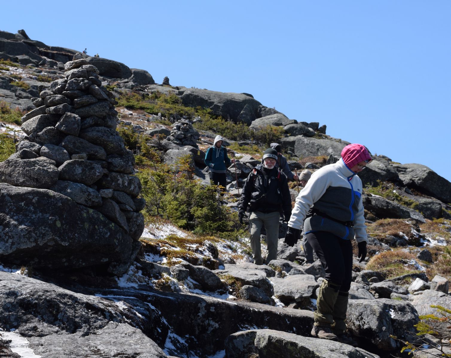 Hikers descend Algonquin's steep summit cone.