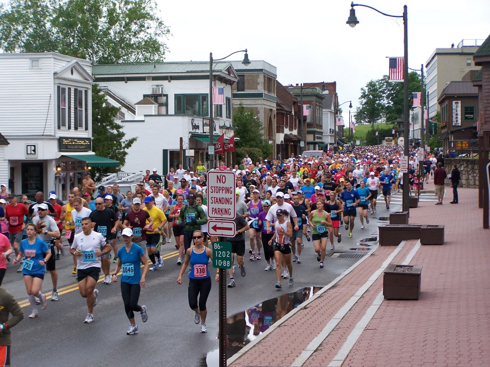 Runners in the Lake Placid Marathon engulf Main Street at the beginning of the race
