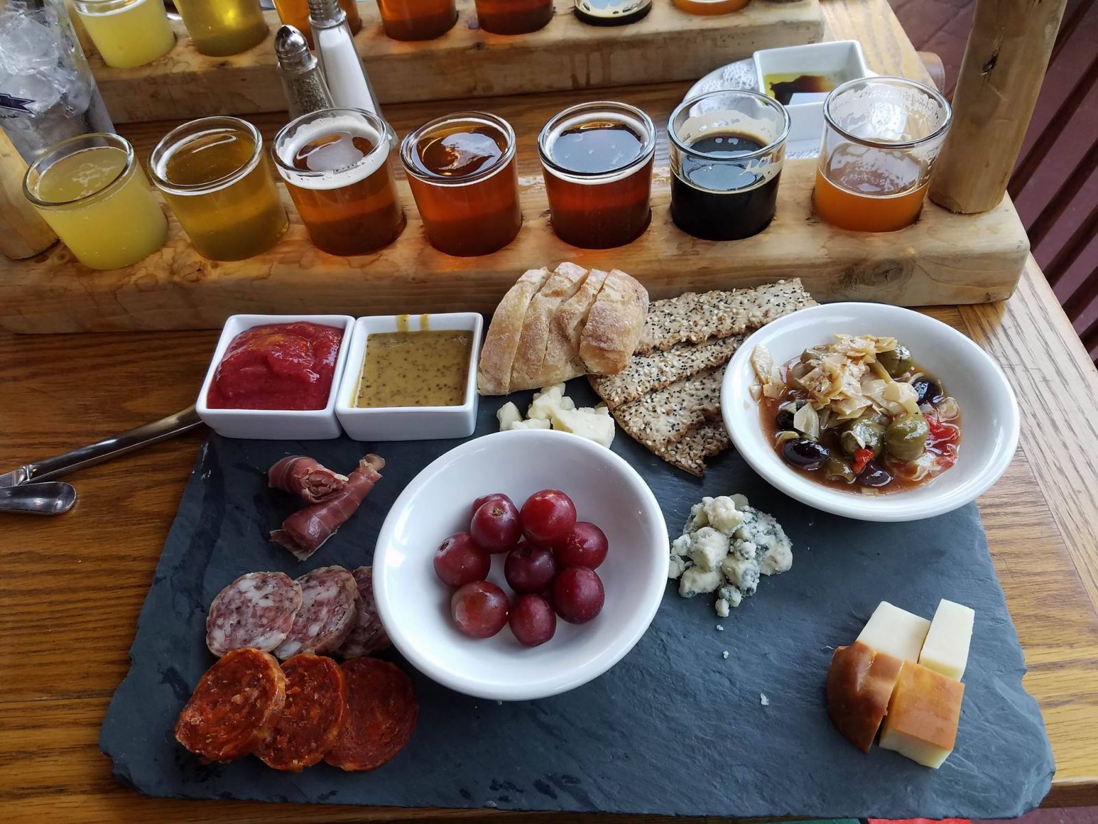 My beer flight accompanied by a delightful cheese and meat platter.