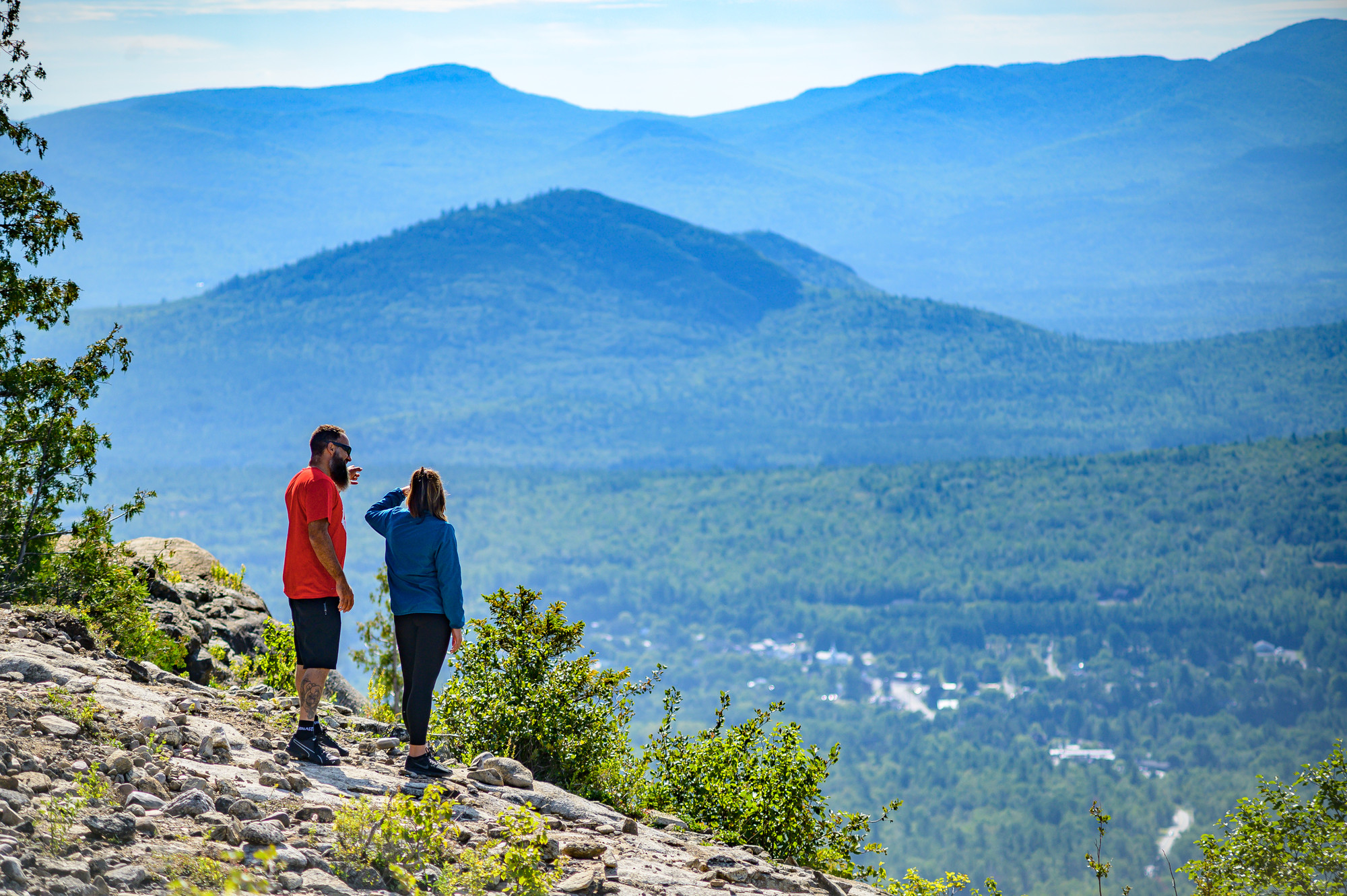 A couple enjoying the view from Cobble Lookout&#44; one of the more popular easy hikes near Lake Placid.