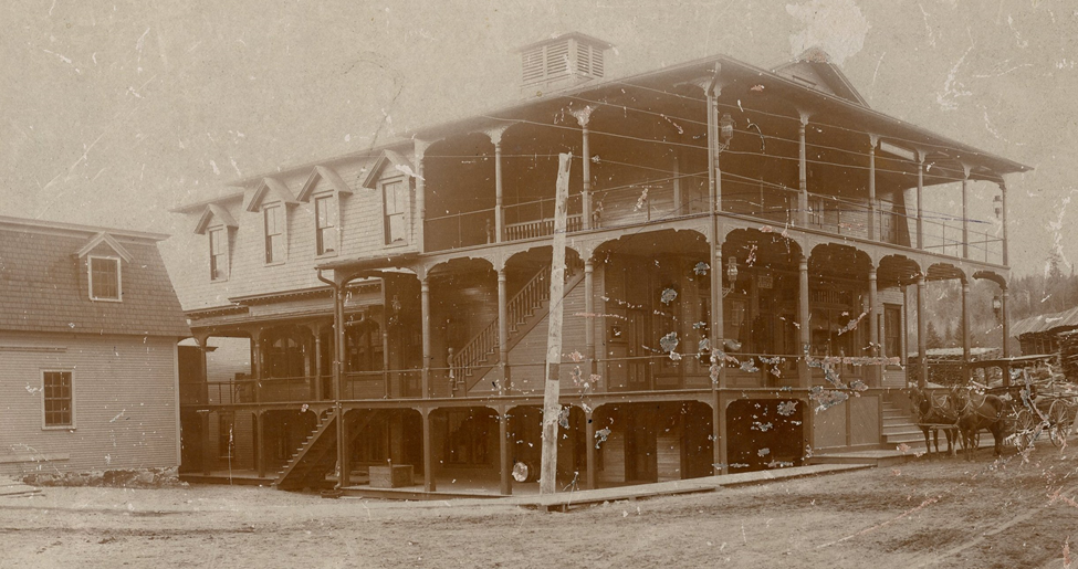 An early photograph of White's Opera House&#44; a three-story Victorian building built in 1885.