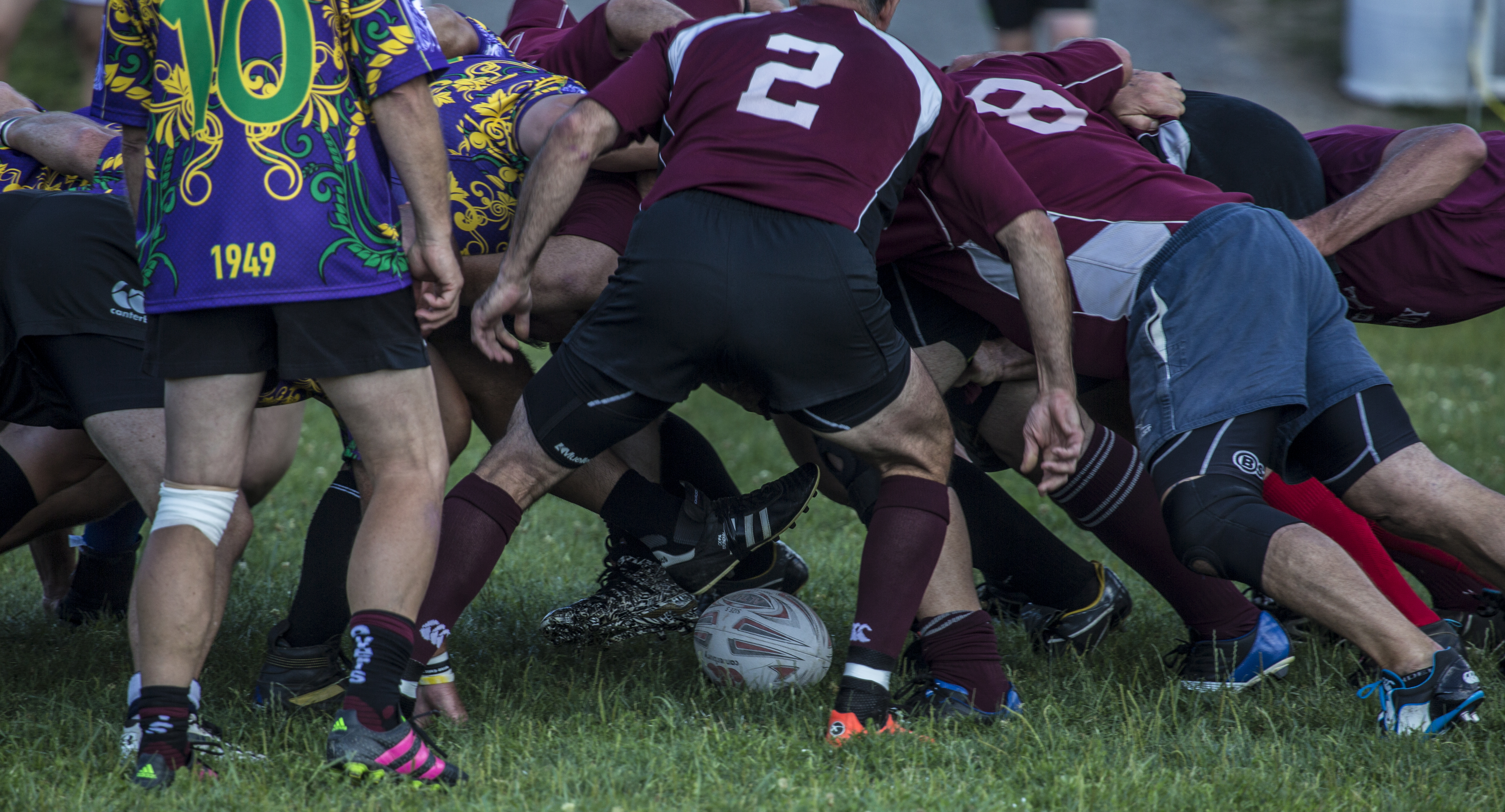 Rugy players pile up in a scrum