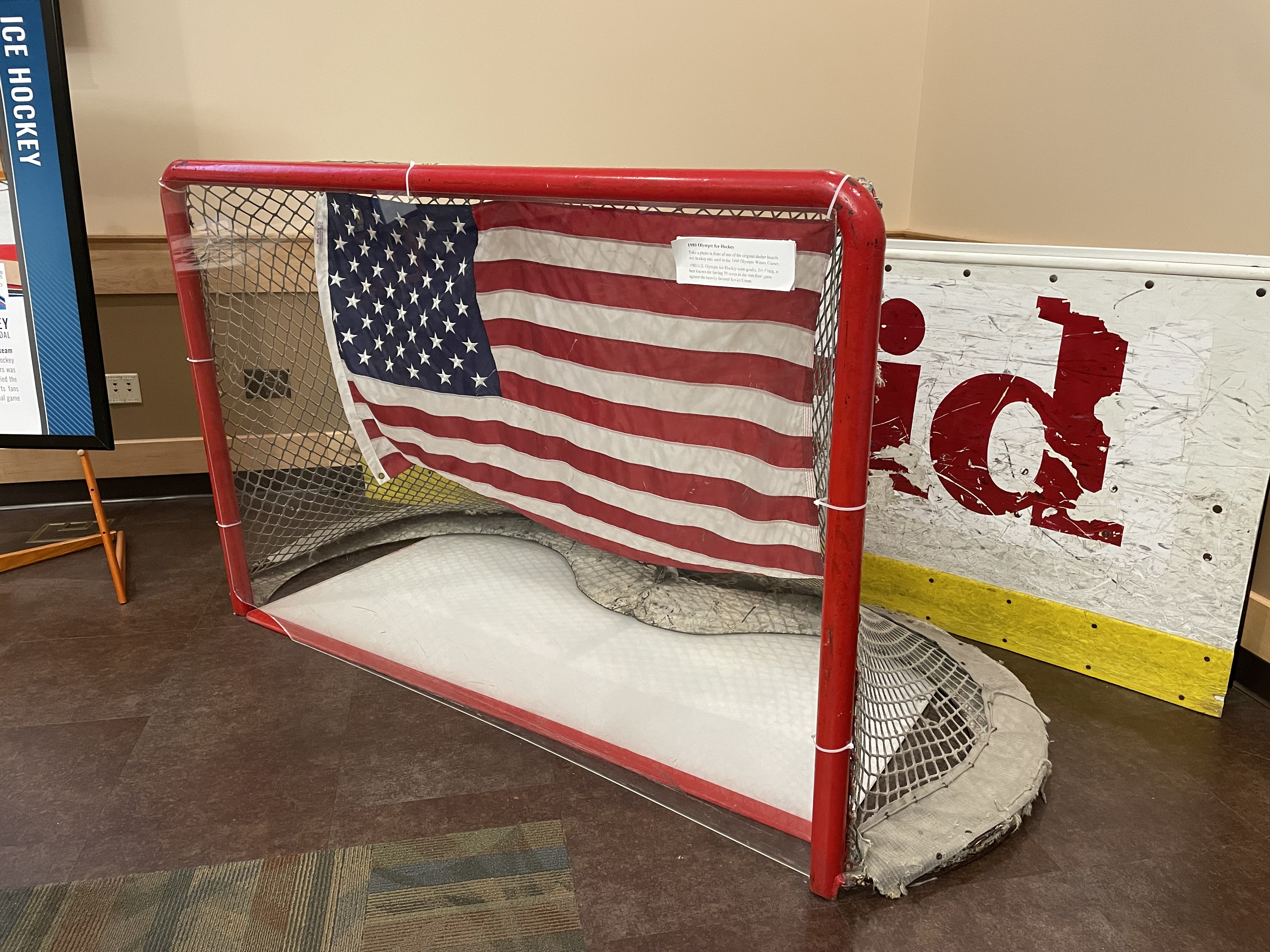 A hockey goal net and rink boards on display. They were used in the 1980 Olympic Winter Games.