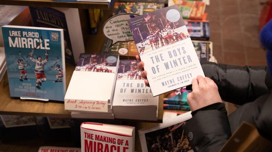 A person picks up a book 