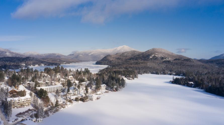A snow covered Lake Placid village and lake