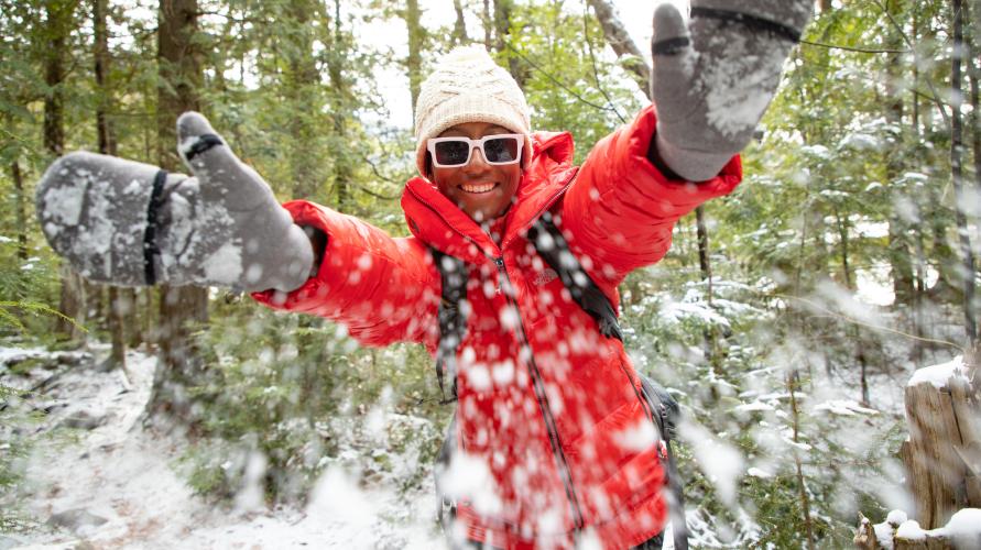 Hiker plays in the snow