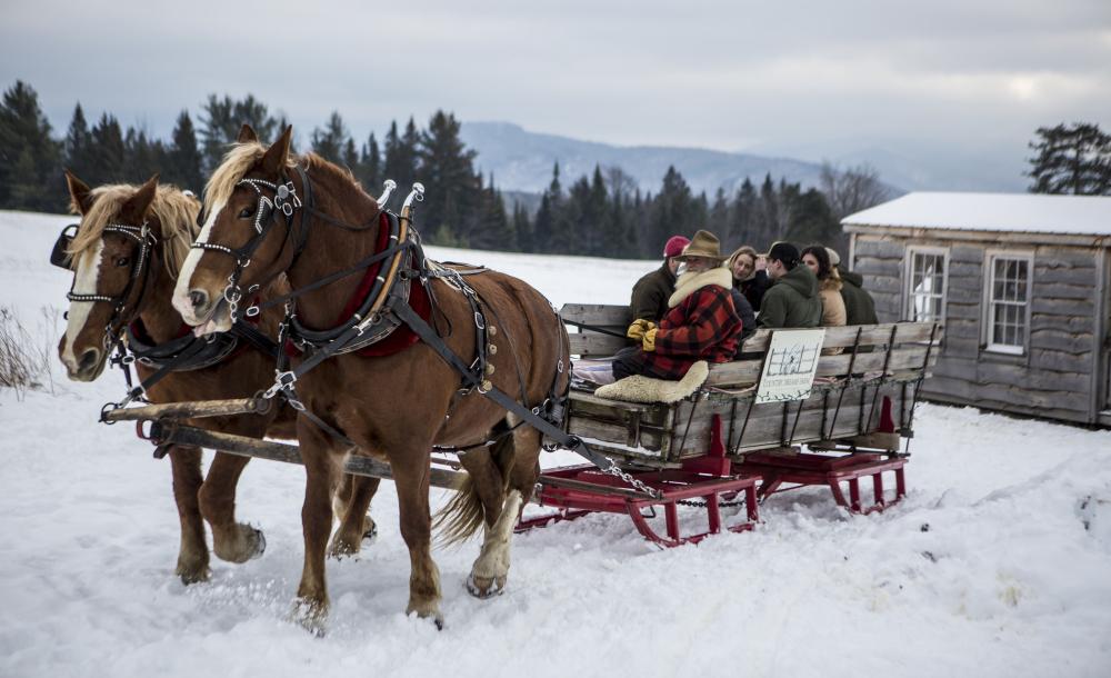 Sleigh ride begins by leaving the cabin.