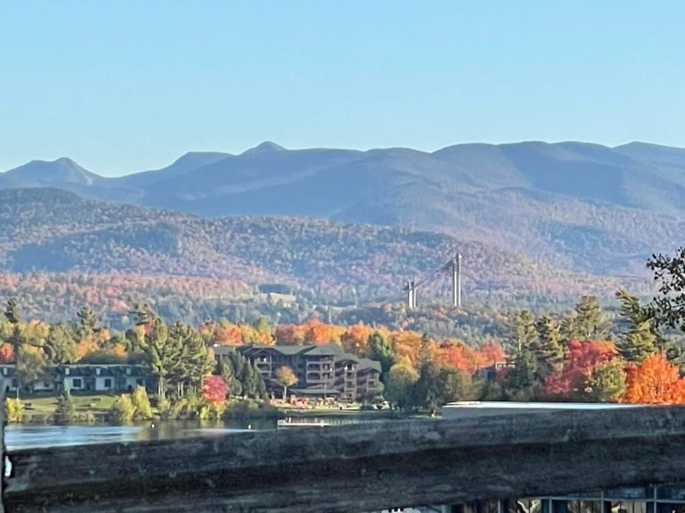 A landscape view of peak fall foliage in the Lake Placid region