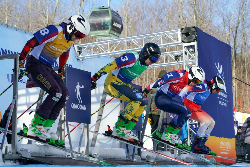 Racers exit the starting gate at Gore Mountain during the Lake Placid 2023 FISU World University Games. Starting gate at Gore Mountain
