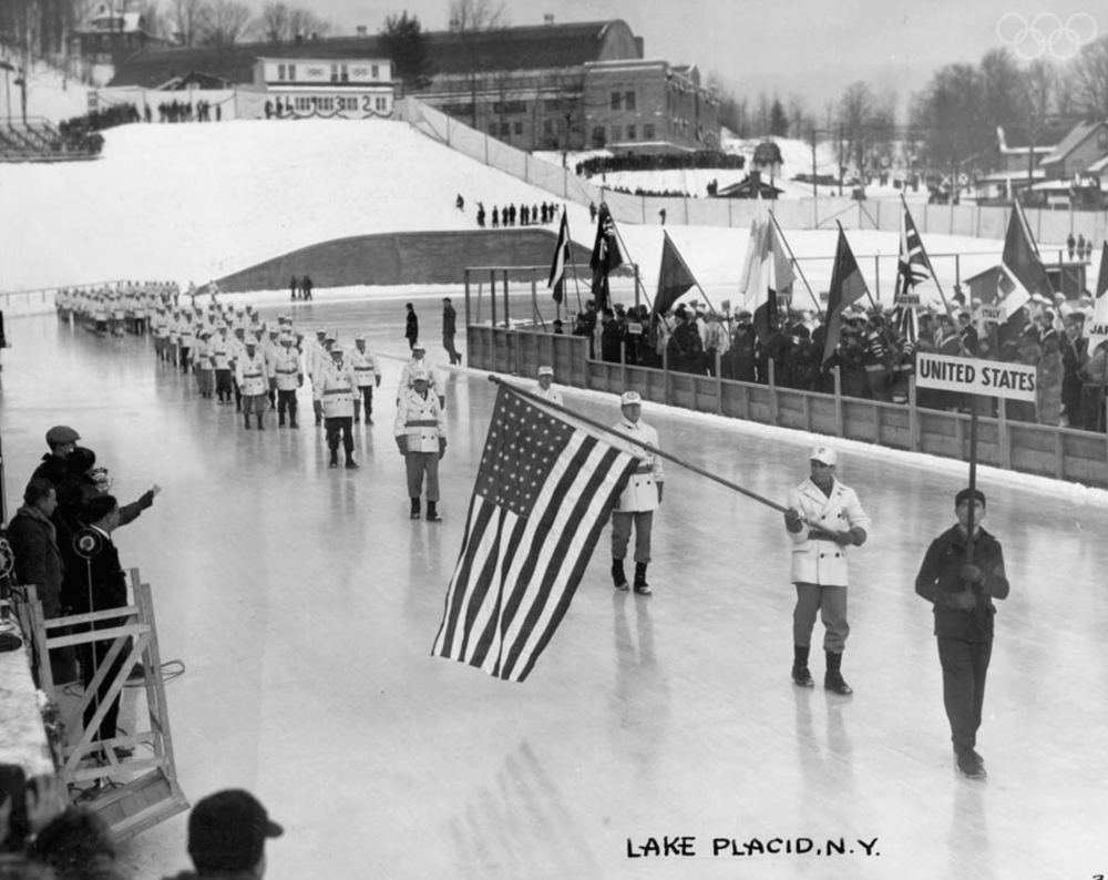 Black and white image of the opening ceremony of the 1932 Olympic Winter Games.