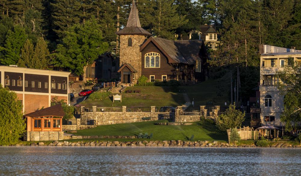 Golden light from sunrise looking at a quant town park in Lake Placid