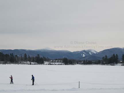 Skiing on Mirror Lake and enjoy the High Peaks View Ski Mirror Lake