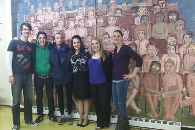 Comedy team poses downstairs at the LPCA