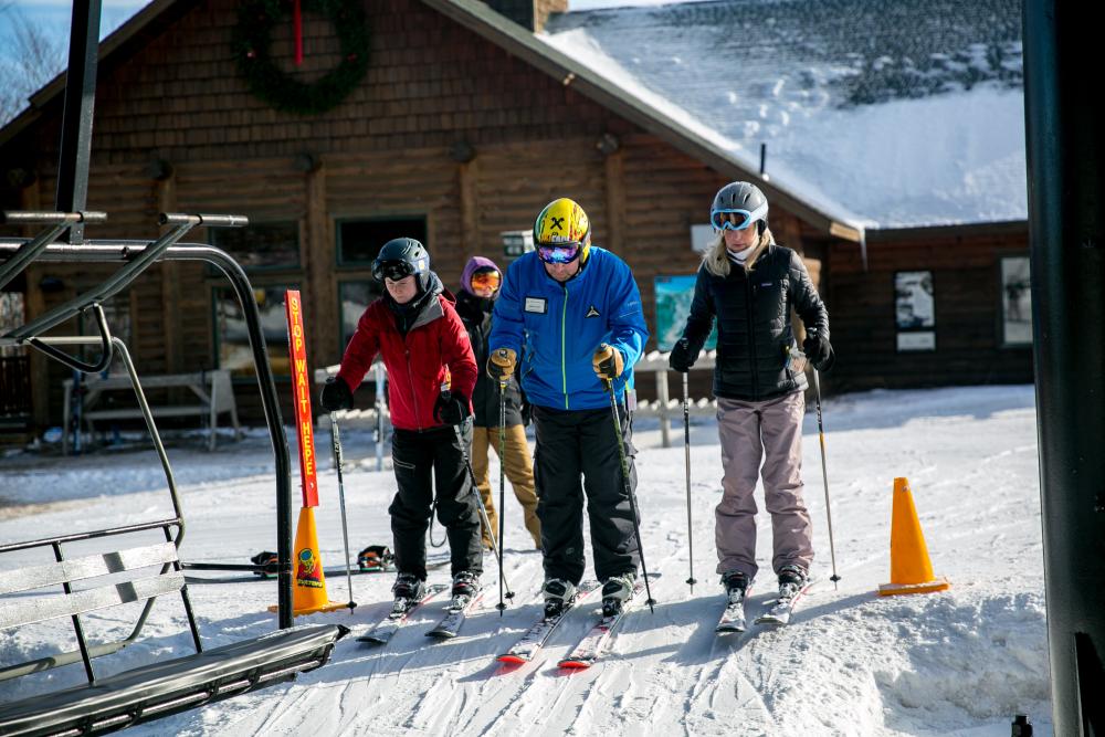 Two skiers start a lesson.