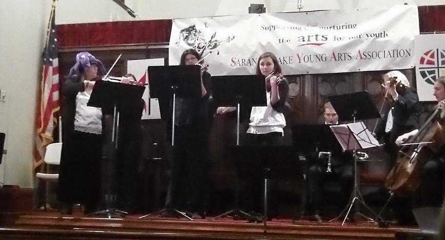 Notice the hat on the Concert Mistress