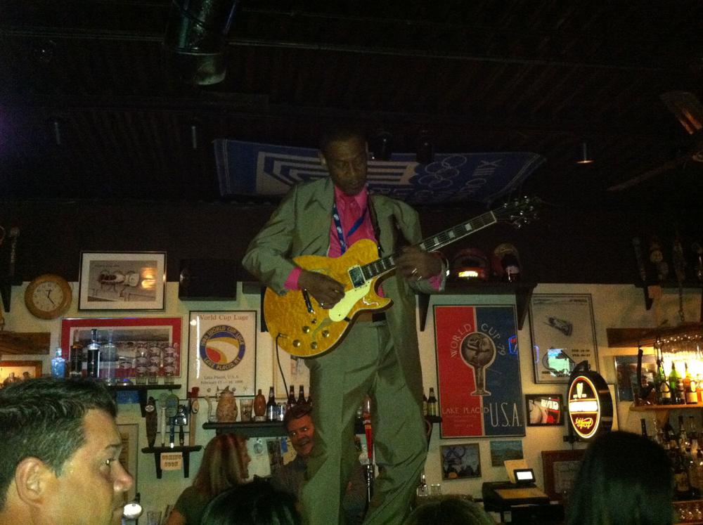 George Boone playing on bar at Zig Zags