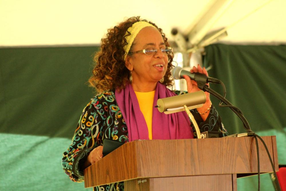 Cherrie Burgess accepts a John Brown Freedom Award on behalf of her late husband, Brother Yusuf Abdul-Wasi.