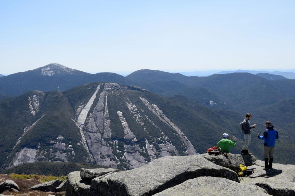 Hikers flock to the summit of Algonquin Peak.