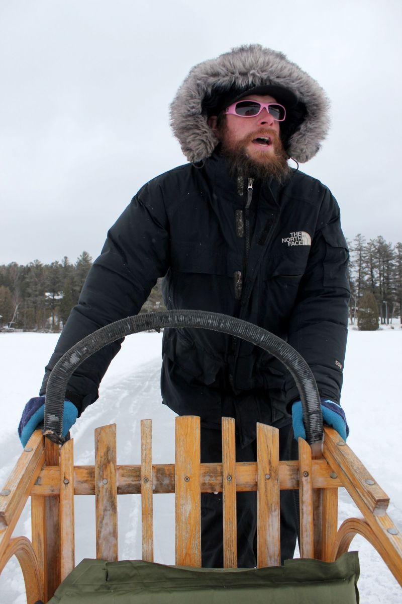 A.J. mushes by giving commands to the lead dogs.