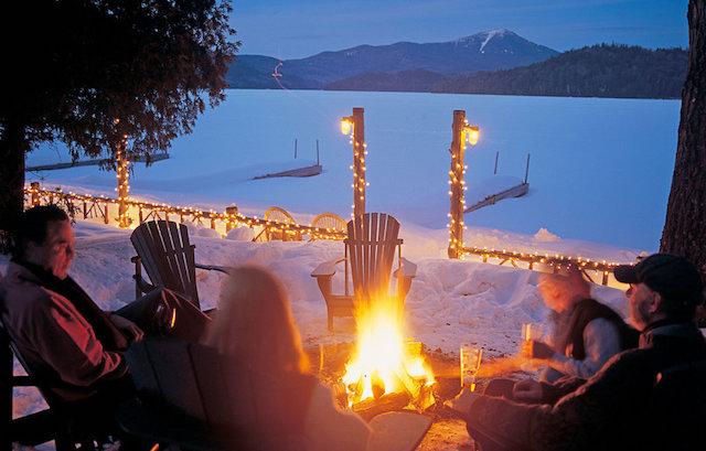 Look over frozen Lake Placid to Whiteface Mountain beyond, while a blazing firepit warms us outside, and eat and drink to warm our inside.