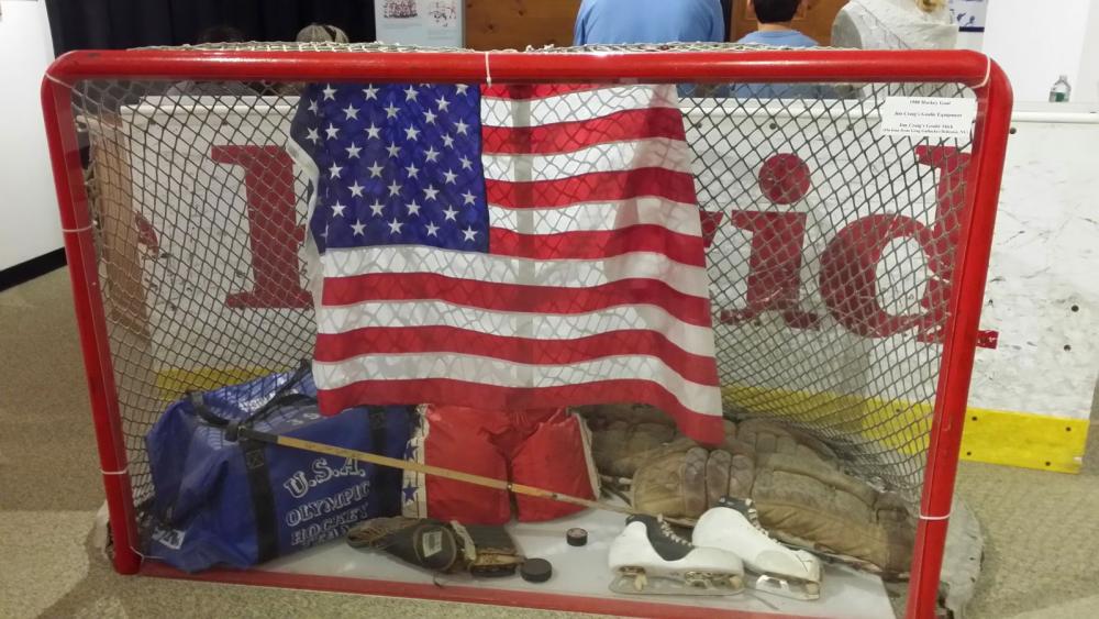 Picture of the hockey net and gear used during the 1980 Olympics on display at the Lake Placid Olympic Museum