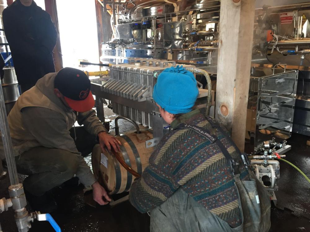 Kirk and Lizzie arranging the bourbon aged barrel.