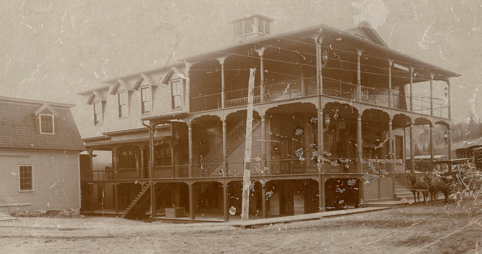 An early photograph of White's Opera House, a three-story Victorian building built in 1885.