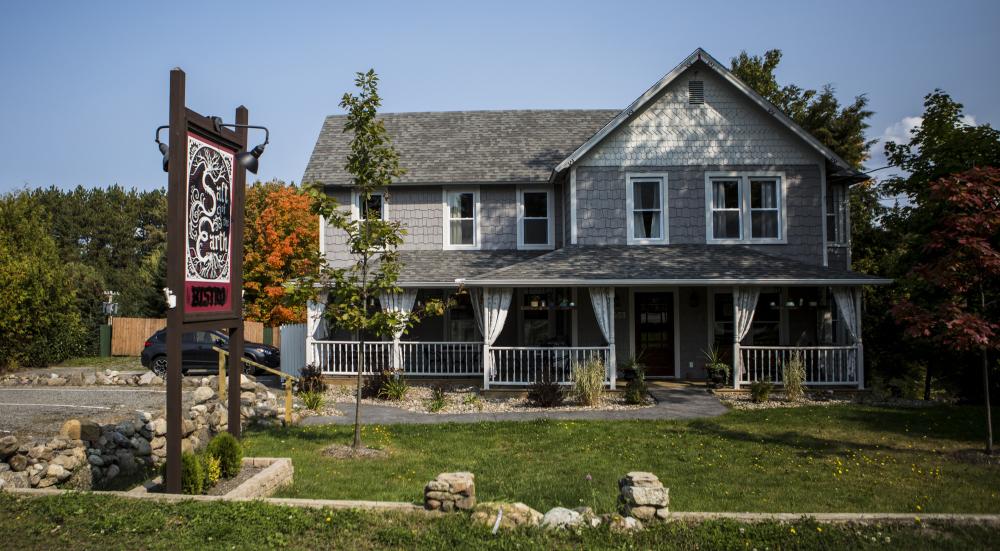 The cozy Salt of the Earth Bistro, a purple-grey building with a homey feel.