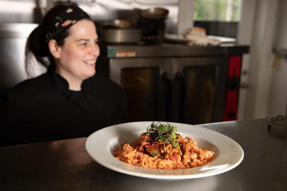 Chef with her dish on the counter