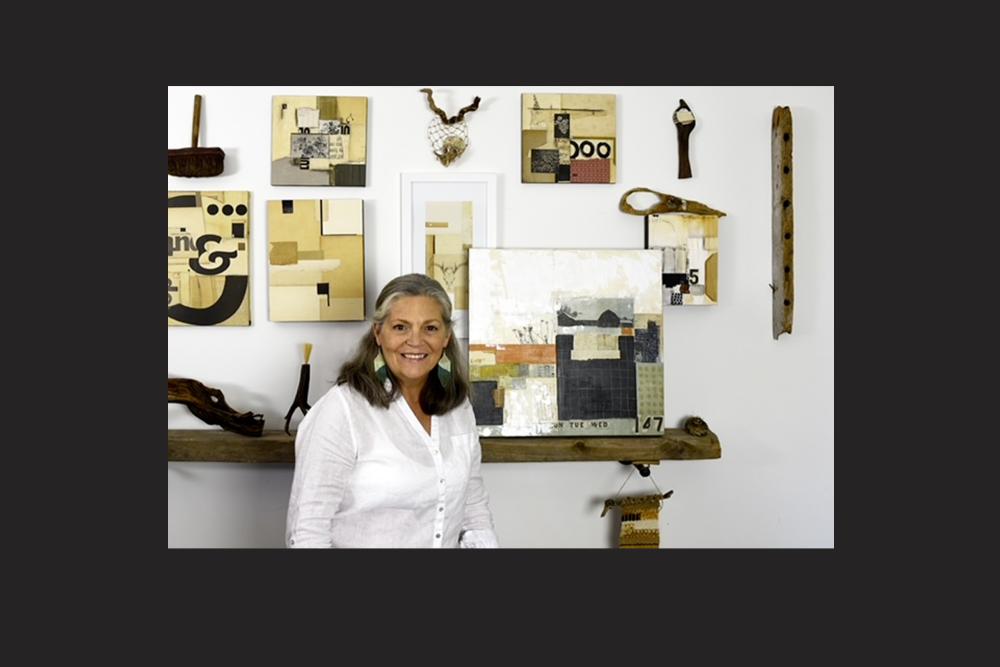 Leslie Rottner with some of her artwork. A woman stands with her collage artworks.