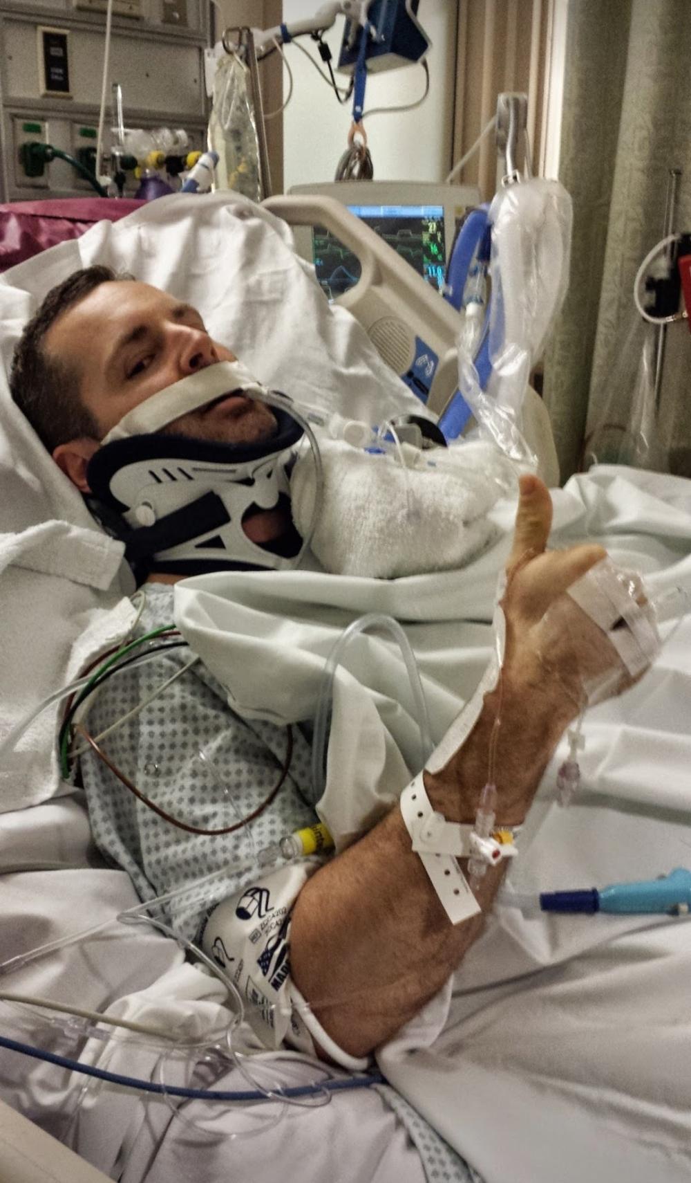 David Christopher in a hospital bed, attached to a ventilator and various medical devices l following his motorcycle accident. A picture of David Christopher in November 2010. He was a US Army Captain with the 414th Civil Affairs Battalion as part of the United States Civil Affairs and Psychological Operations Command. Image courtesy of David Christopher.