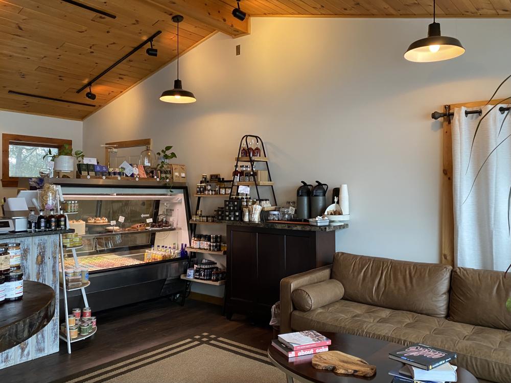 The casual couch-seating area and pastry shelf at Enuf