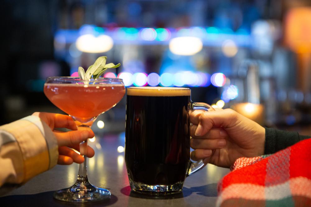 couple cheers with their beverages