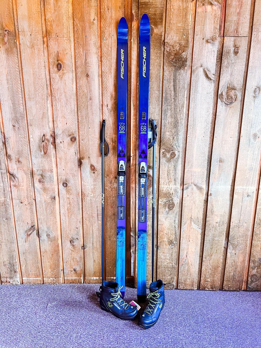 A new pair of blue skis and boots on display