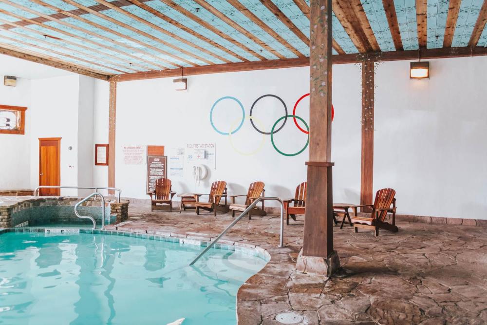 The Olympic Rings adorn the wall above the indoor swimming pool at the Golden Arrow Lakeside Resort