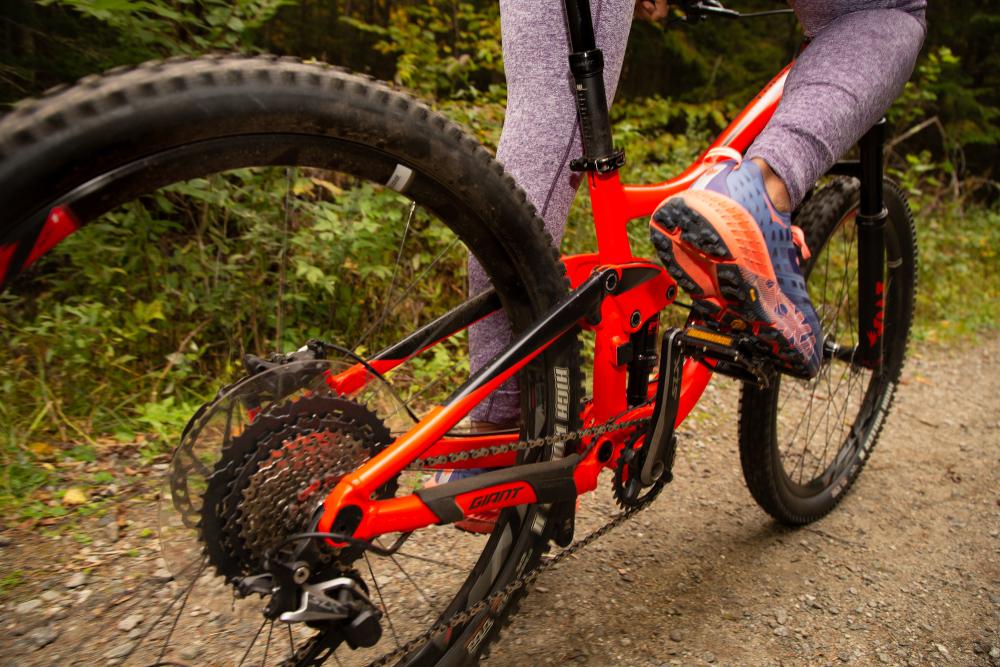 a close up shot of someone peddling on a bicycle.