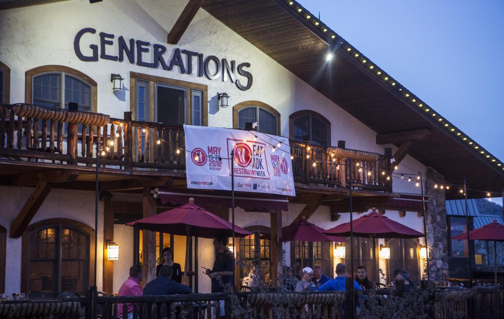 A tuscan-style restaurant patio at night.