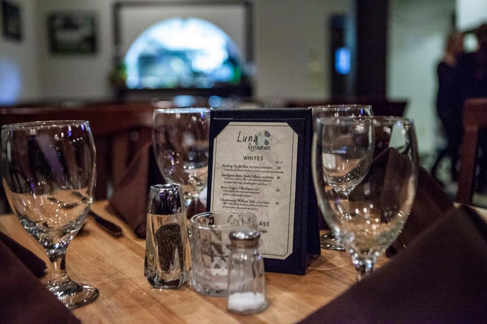 Wine glasses surround Luna Restaurant's drink list.
