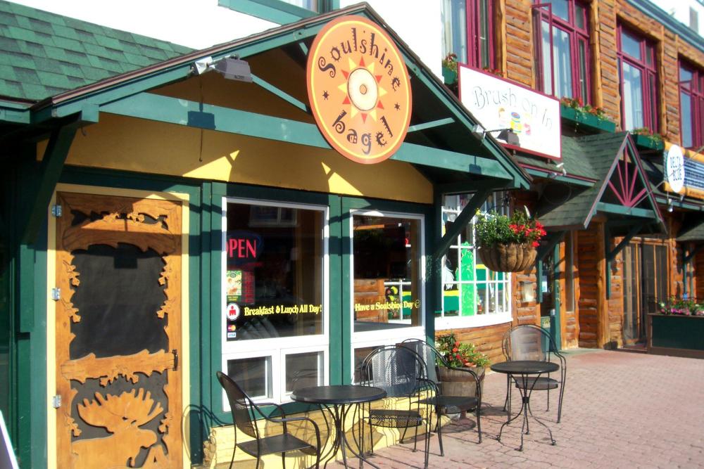 The front of a happy bagel shop named Soulshine Bagel.